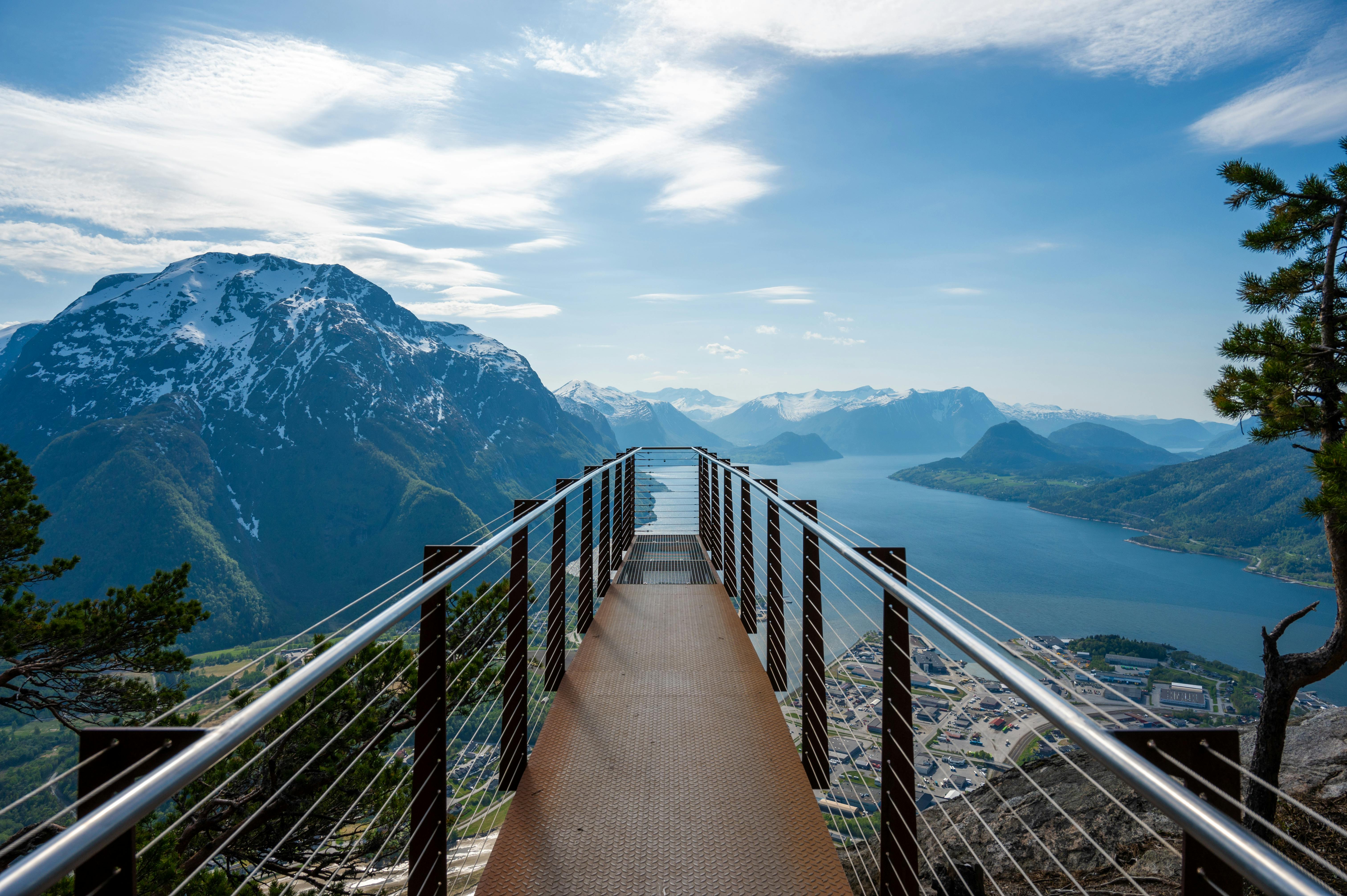 View from Ørnesvingen viewpoint showing the Eagle Road hairpin bends descending toward Geirangerfjord